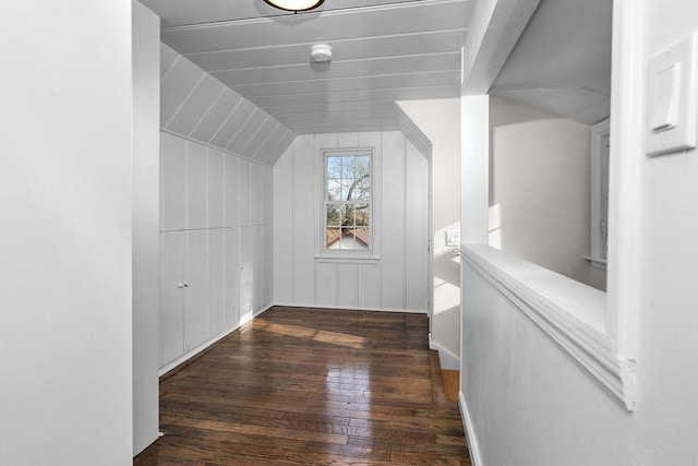 additional living space featuring dark hardwood / wood-style flooring and vaulted ceiling