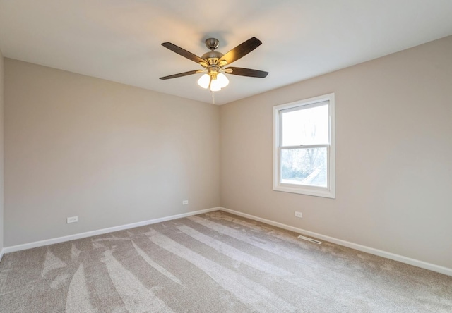 unfurnished room with ceiling fan and carpet floors