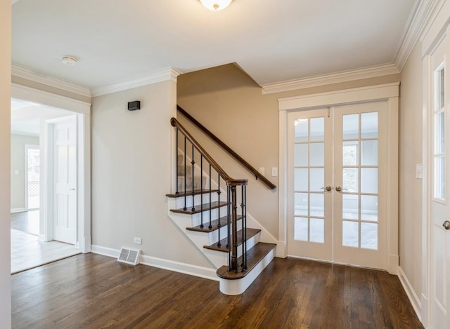 interior space featuring crown molding, french doors, a healthy amount of sunlight, and hardwood / wood-style flooring