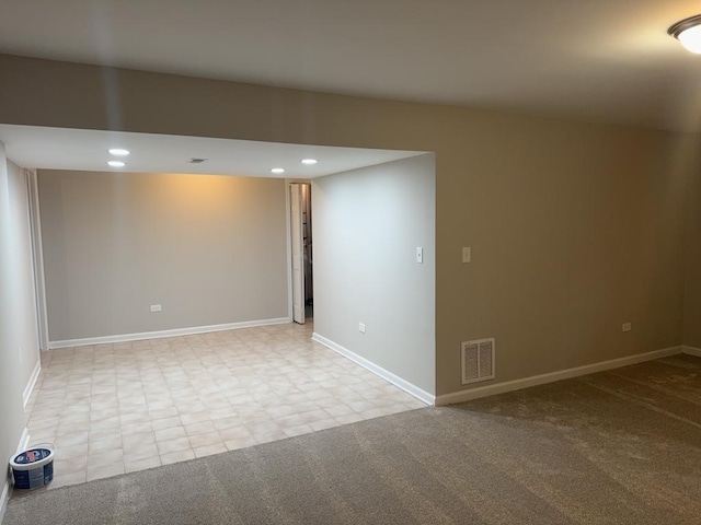 spare room with light colored carpet