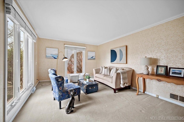 living room featuring ornamental molding and light carpet