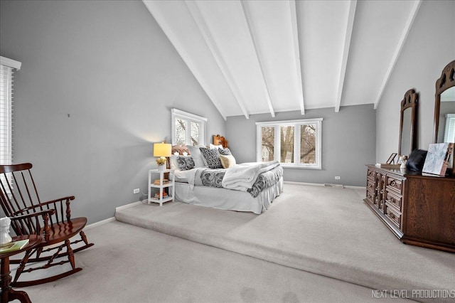 carpeted bedroom featuring beam ceiling, high vaulted ceiling, and multiple windows