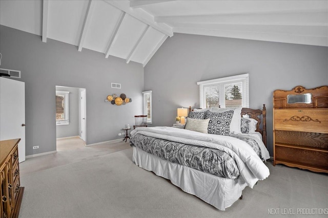 bedroom with beam ceiling, light carpet, and high vaulted ceiling