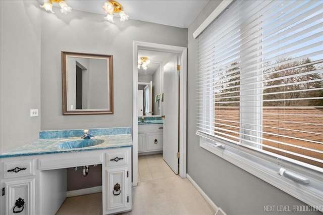 bathroom with vanity and tile patterned floors