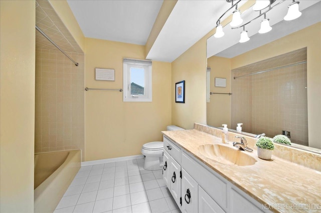 full bathroom with vanity, tiled shower / bath, tile patterned flooring, and toilet