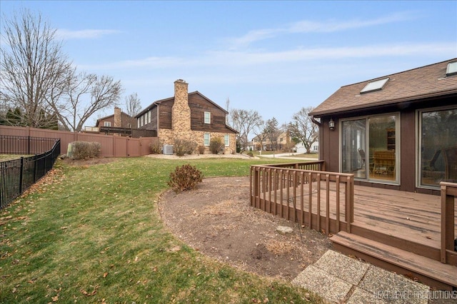 view of yard with a wooden deck