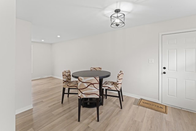 dining space featuring light hardwood / wood-style floors