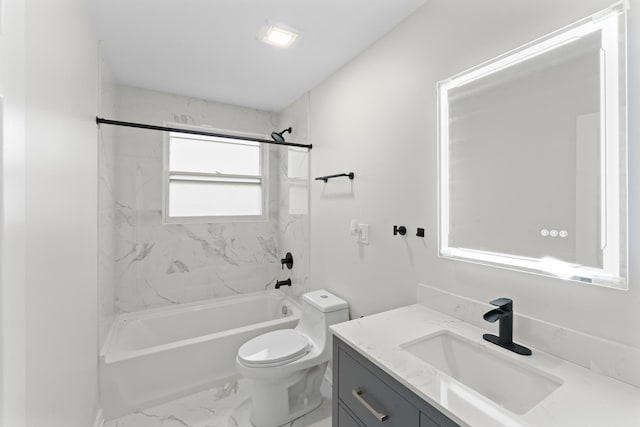 full bathroom with vanity, toilet, and tiled shower / bath