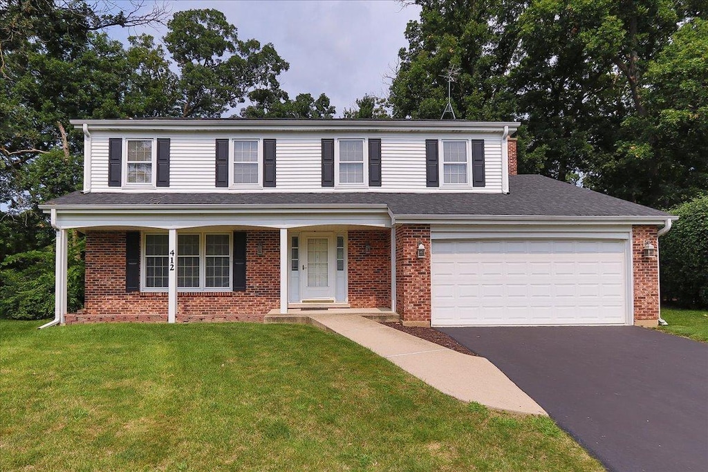 view of front of house with a front lawn and a porch