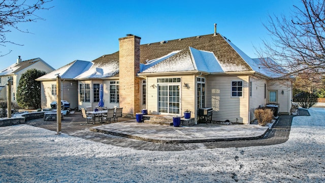 back of property with a patio area