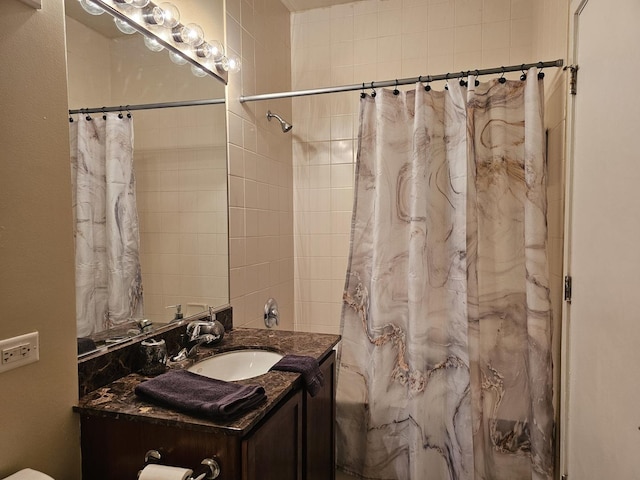 bathroom with a shower with shower curtain and vanity