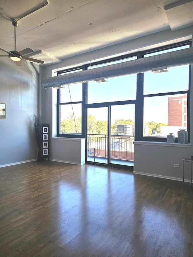 unfurnished room featuring ceiling fan and dark hardwood / wood-style floors