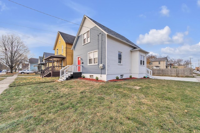 view of home's exterior featuring a yard