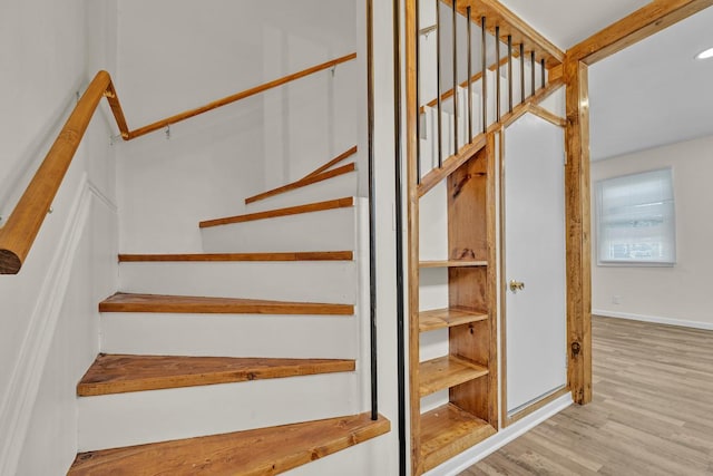 staircase featuring hardwood / wood-style flooring