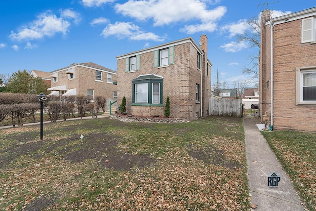 front facade featuring a front yard