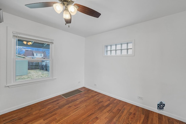 spare room featuring ceiling fan and hardwood / wood-style flooring