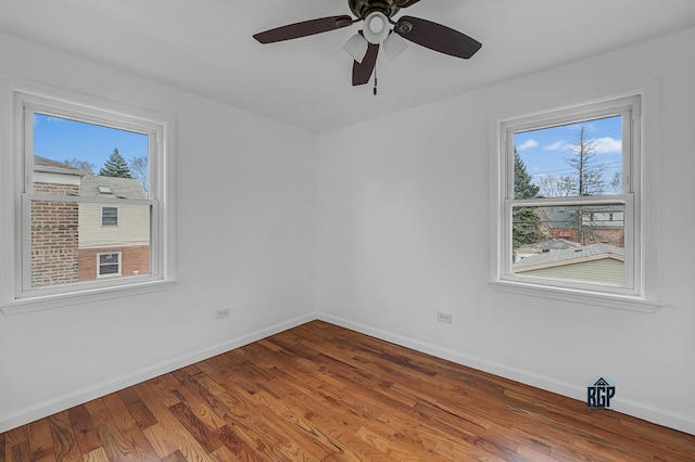 spare room featuring hardwood / wood-style flooring and ceiling fan