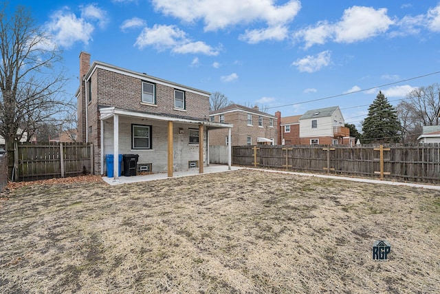 rear view of house featuring a patio area and central AC