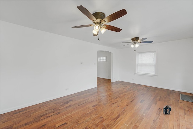 spare room featuring hardwood / wood-style flooring and ceiling fan