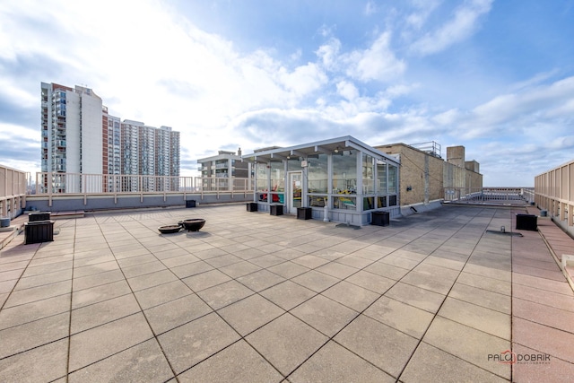 view of patio / terrace with an outdoor fire pit