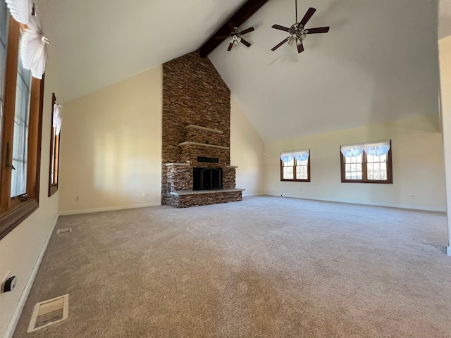 unfurnished living room featuring beam ceiling, ceiling fan, carpet, and high vaulted ceiling