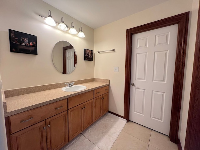 bathroom with tile patterned floors and vanity