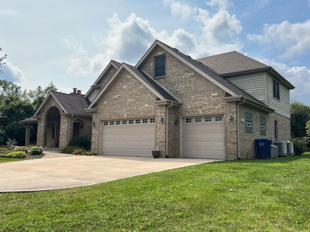 view of front of home featuring a garage and a front lawn