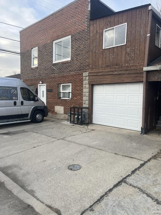 view of side of home with a garage