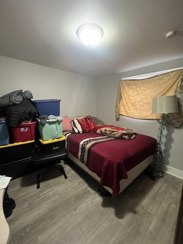 bedroom featuring wood-type flooring