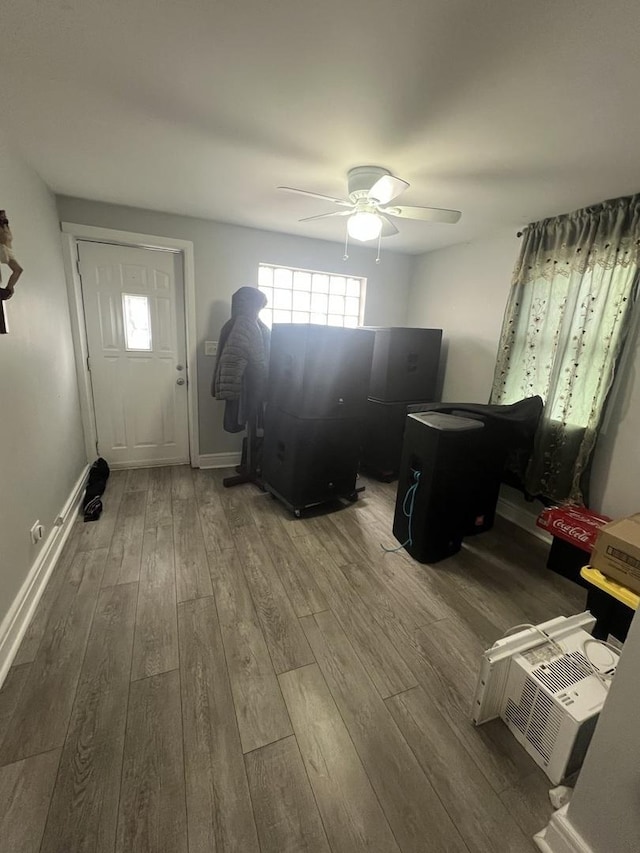 interior space featuring hardwood / wood-style flooring and ceiling fan