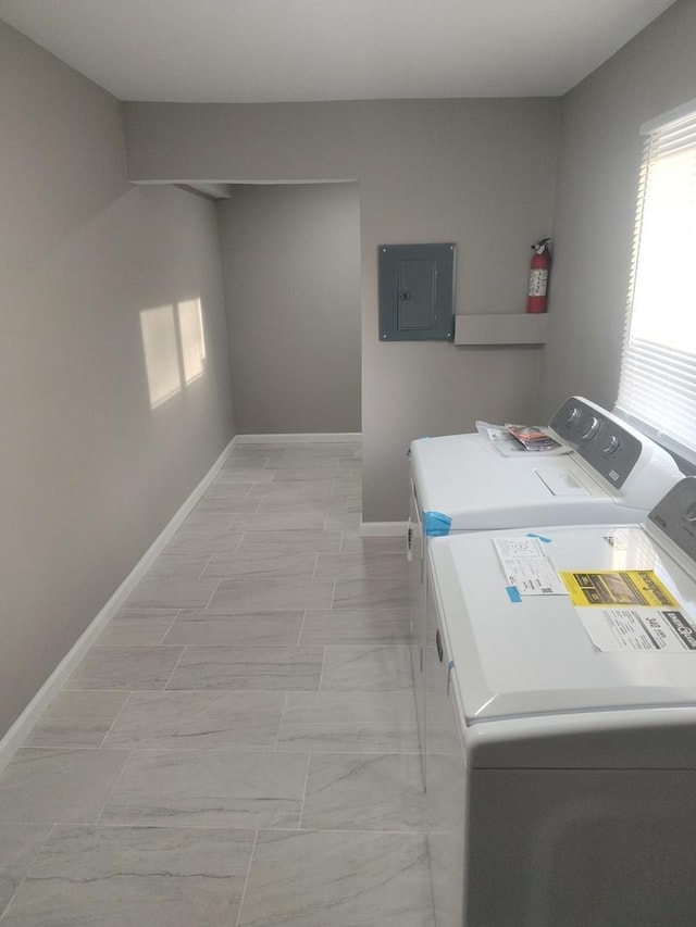 laundry room with independent washer and dryer and electric panel