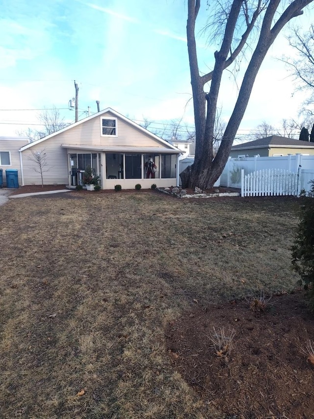 view of front of home with a patio and a sunroom