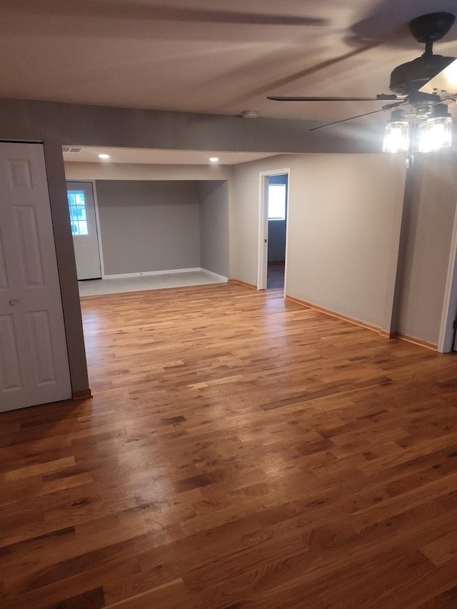 basement with dark hardwood / wood-style flooring