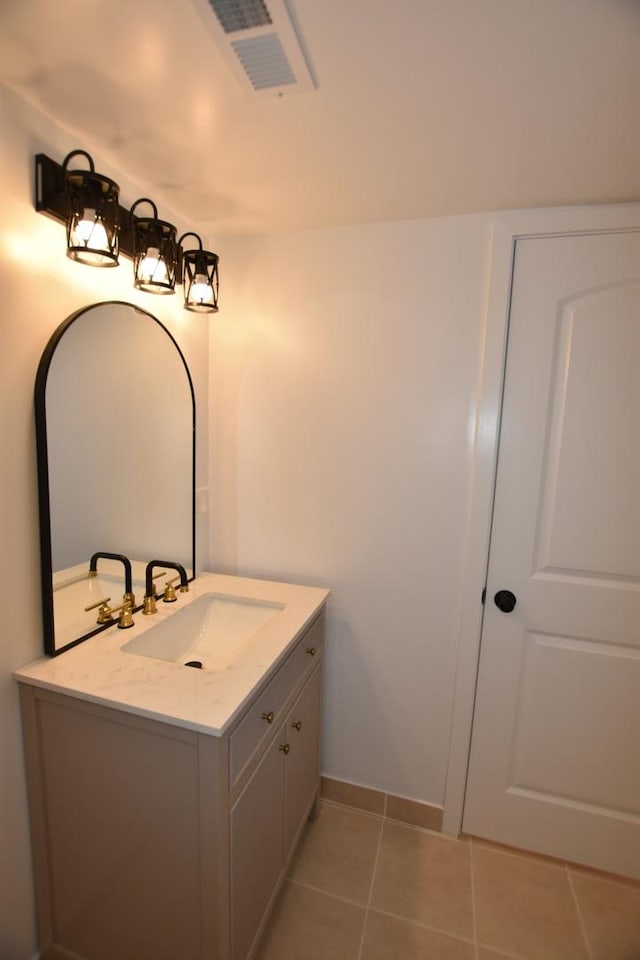 bathroom with tile patterned floors and vanity