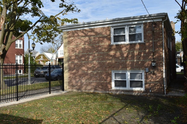 view of home's exterior with a yard