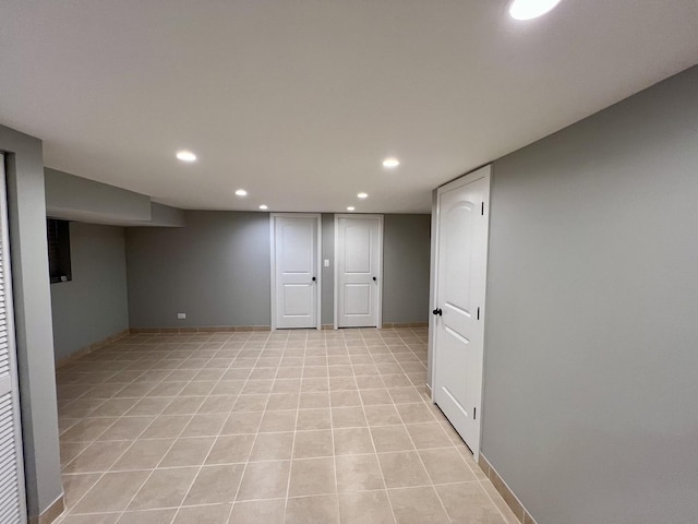 basement with light tile patterned flooring