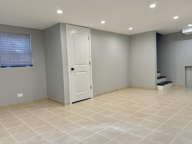 basement featuring light tile patterned floors