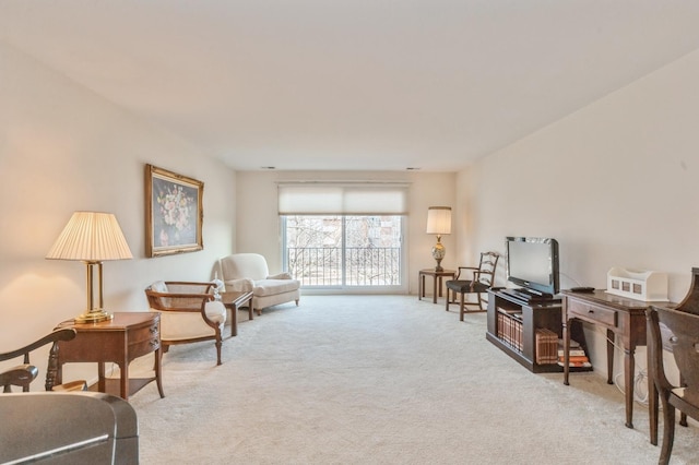 living area with light colored carpet