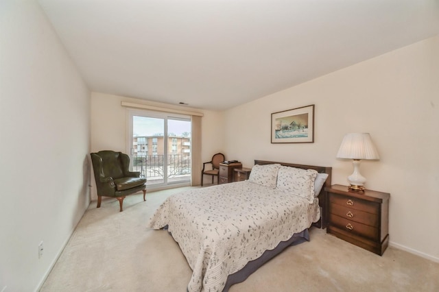 carpeted bedroom featuring access to exterior