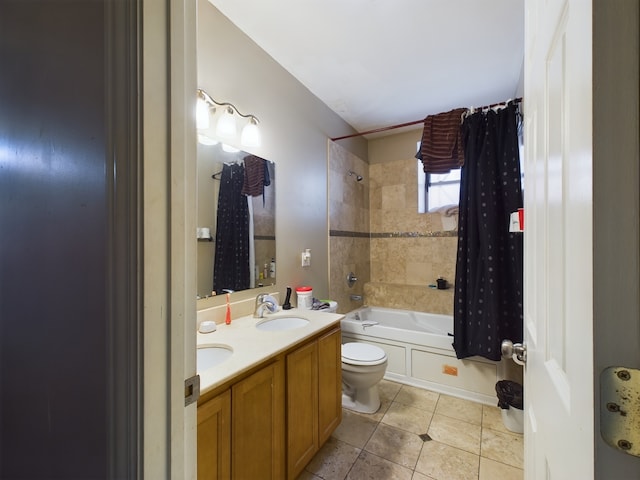 full bathroom featuring tile patterned flooring, shower / tub combo, vanity, and toilet