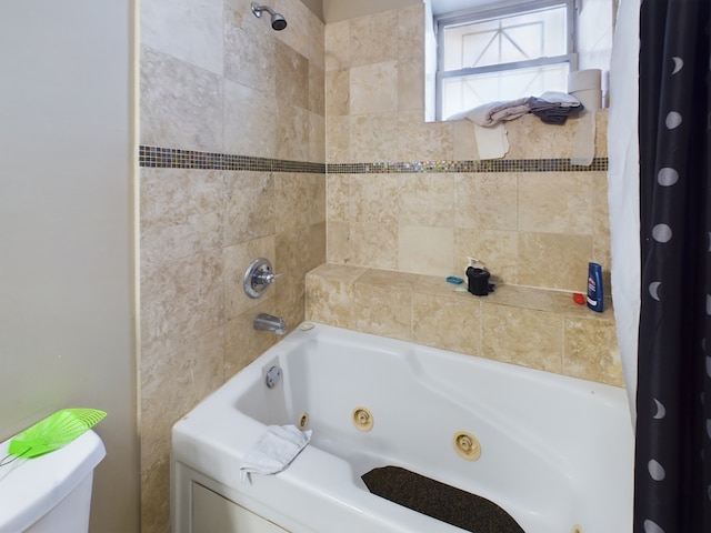 bathroom with shower / bath combination with curtain and toilet