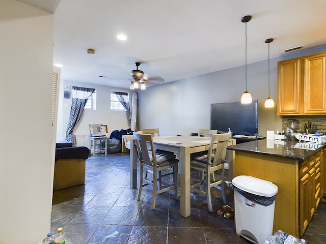 dining room featuring ceiling fan