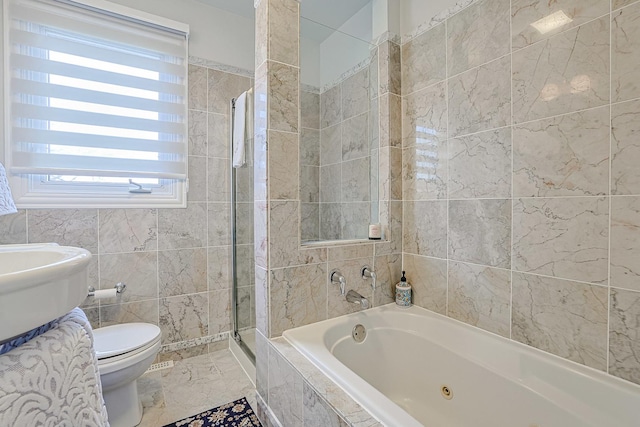 bathroom with marble finish floor, tile walls, toilet, a shower stall, and a whirlpool tub