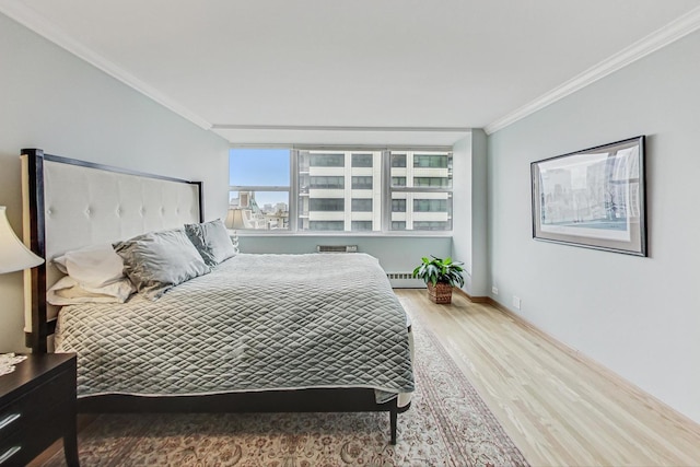 bedroom featuring wood-type flooring and ornamental molding