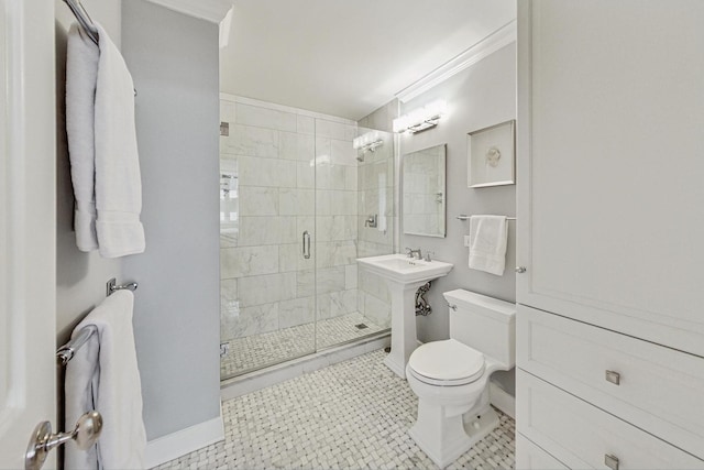 bathroom featuring sink, tile patterned flooring, a shower with shower door, toilet, and crown molding