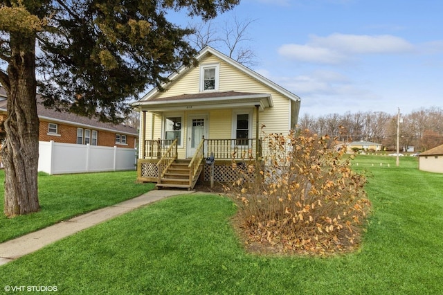 view of front of house with a front lawn and a porch