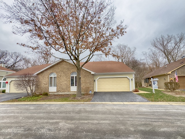 ranch-style house featuring a garage