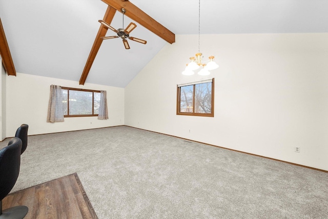 unfurnished living room featuring beam ceiling, carpet floors, ceiling fan with notable chandelier, and high vaulted ceiling