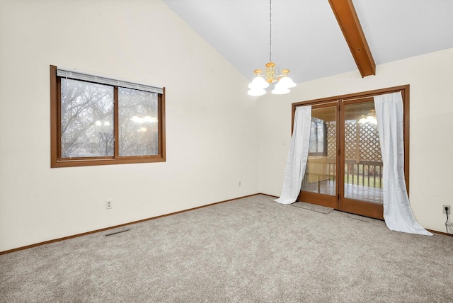 unfurnished room featuring a notable chandelier, lofted ceiling with beams, and carpet