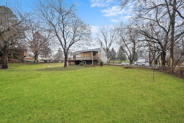 view of yard featuring a wooden deck